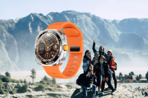 Smartwatch with orange band next to happy group outdoors.